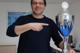 Ausgezeichnet: Uli Kussin, Leiter des Hochschulsports der Universität Paderborn, freut sich über den ersten Platz. Foto: Heiko Appelbaum
