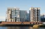 Fotograf: Alex Bach Architekturfotografie // Nutzungsrecht: Schüco International KG Der filigrane Wohnturm mit seiner klar gegliederten Fassade, den vertikalen Einschnitten für Balkone und der markanten Krone mit Dachgarten setzt einen markanten Akzent im Stadtbild.